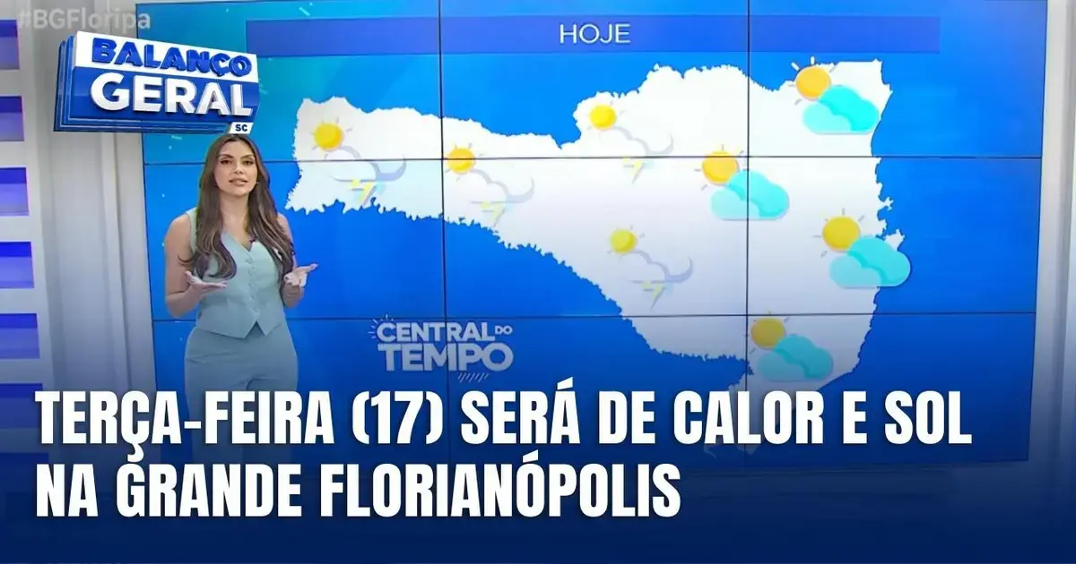 Apresentadora de noticiário aponta para mapa do tempo, com previsão de calor e sol na Grande Florianópolis.