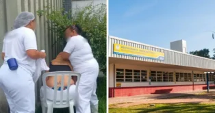 Três pessoas em uniformes brancos, uma sentada, recebendo cuidados em ambiente externo ao lado de um restaurante universitário.
