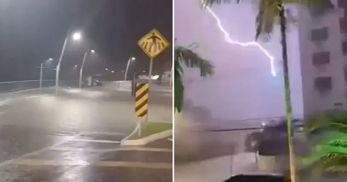 Cenas de forte chuva e iluminação em um ambiente urbano, com ruas alagadas e sinalização visível.
